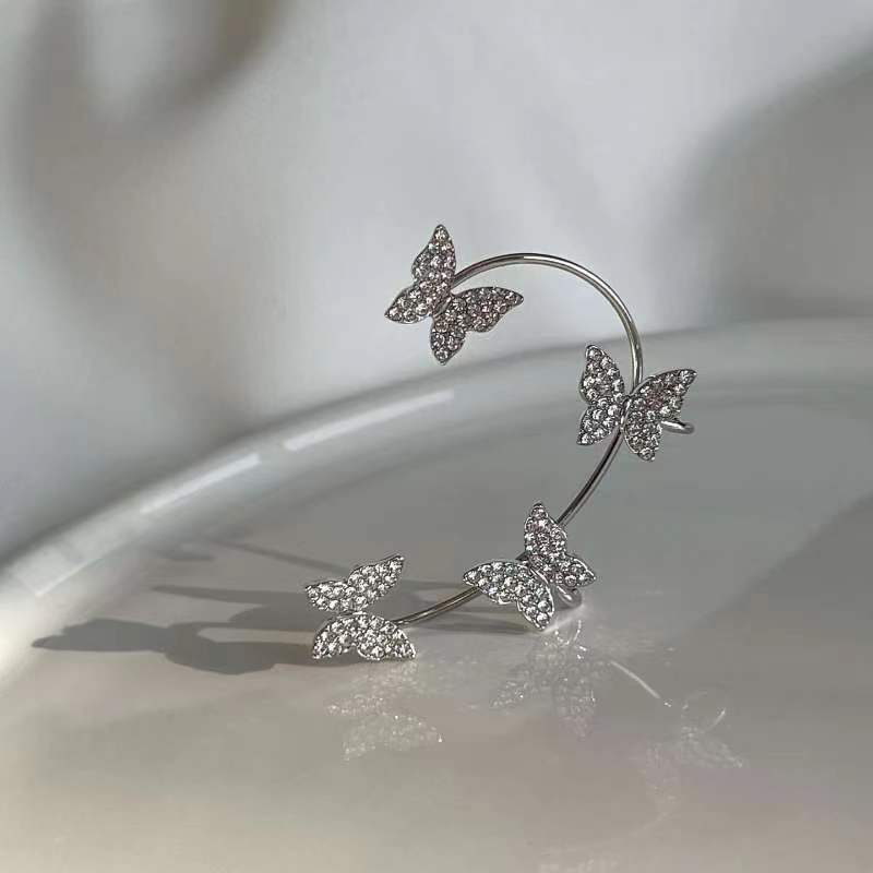 Venta al por mayor Pendientes de aleación de manguito de oreja de mariposa de diamante